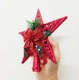Ngôi sao đỉnh trang trí cây thông kèm nơ và hoa trạng nguyên đỏ cao 23cm