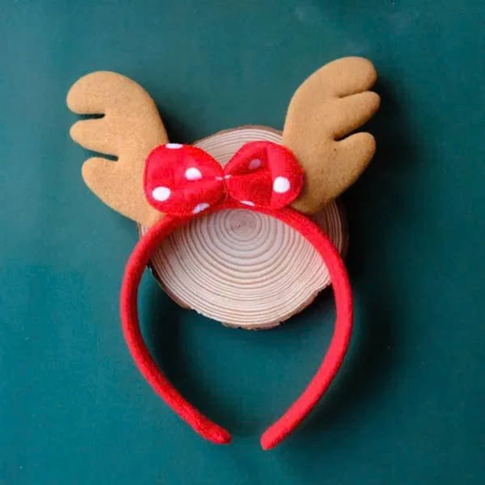 Băng đô noel sừng tuần lộc vàng nơ đỏ