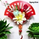 Quạt đỏ cát tường và dây pháo tài lộc trang trí tết