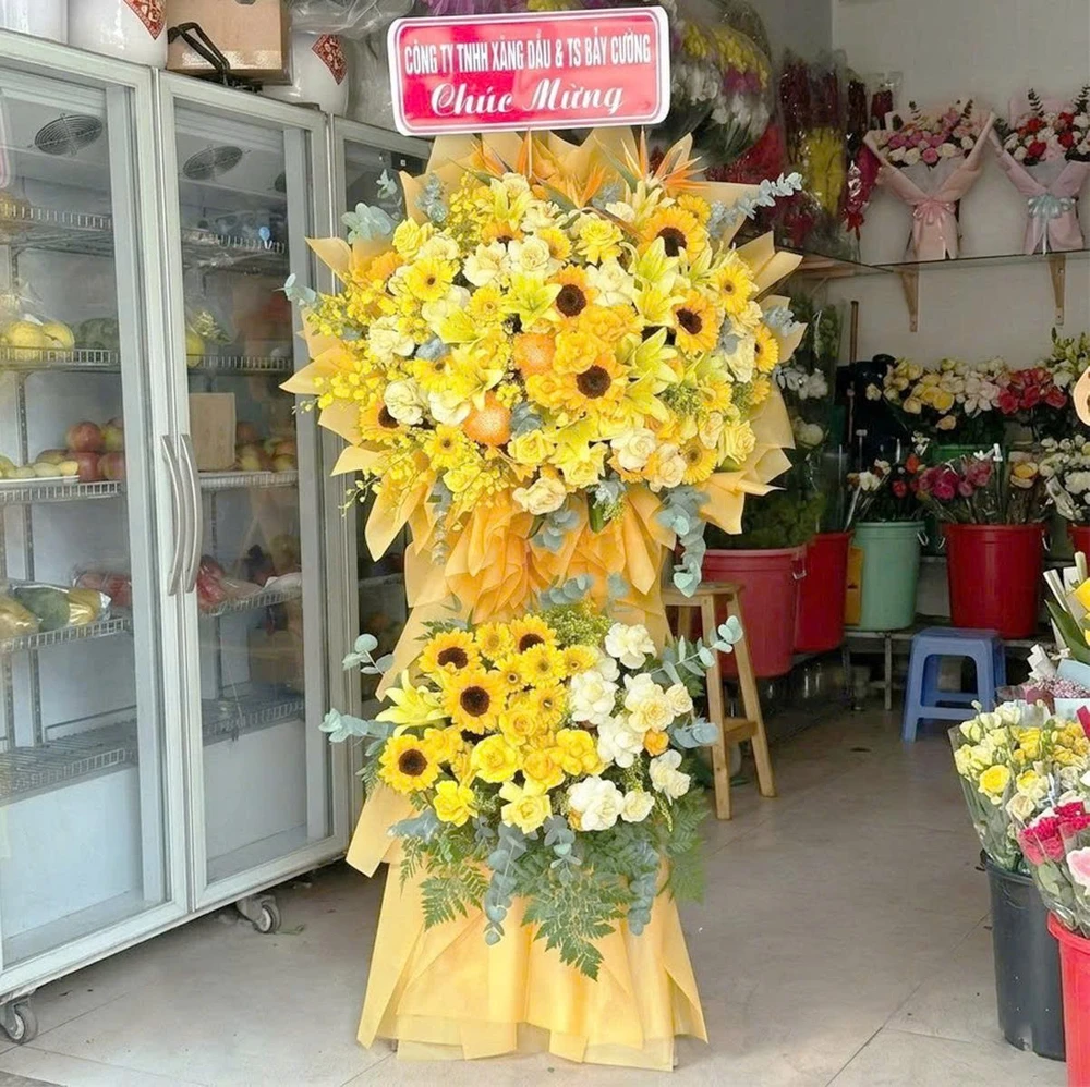 Kệ Hoa Mừng Khai Trương 2 Tầng Tone Vàng Cam Hướng Dương Mix Hoa Ly